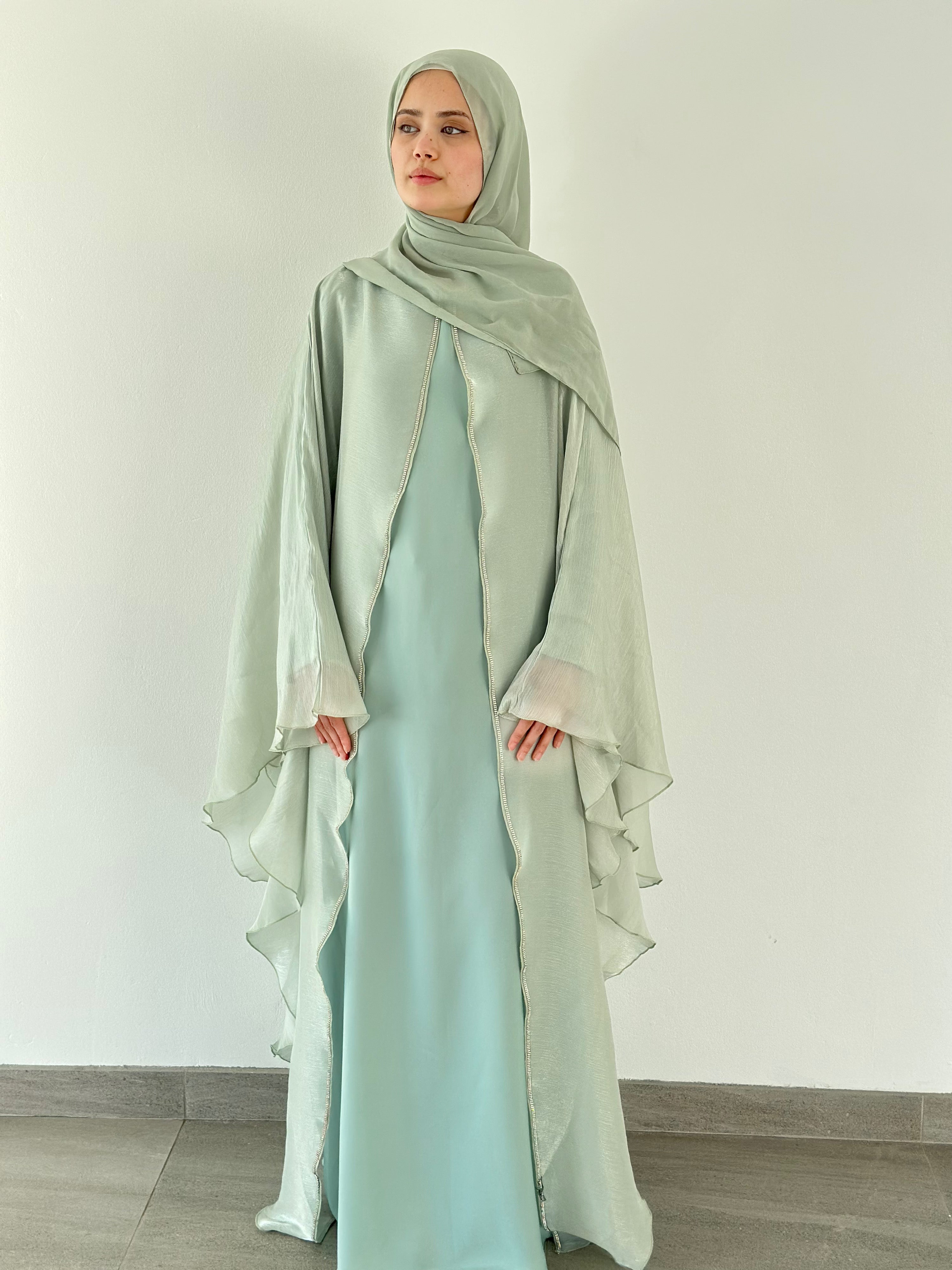 Nujūm Al Thawb Reversible Embroidered Abaya
